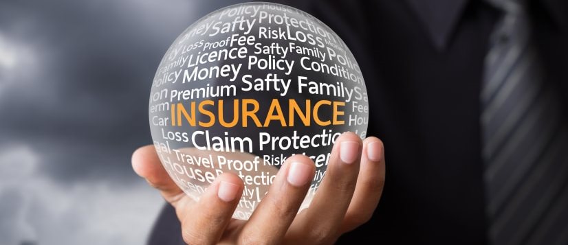 man holding insurance globe