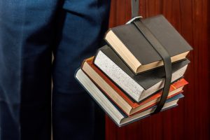 a person holding books